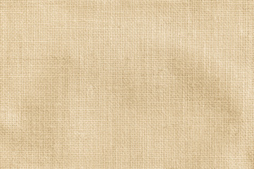 Fototapeta na wymiar Hessian sackcloth woven texture pattern background in yellow beige cream brown color