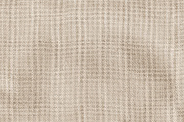 Fototapeta na wymiar Hessian sackcloth woven fabric texture background in beige cream brown color