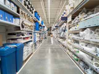 Store for home improvement and DIY. Warehouse aisle of building materials in industiral store. Bit...