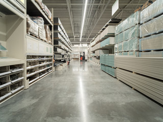 Store for home improvement and DIY. Warehouse aisle of building materials in industiral store....