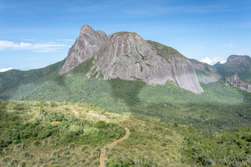 Amazing view of the Three Peaks State Park at Nova Friburgo city, state of Rio de Janeiro, where you can explore the Dragon's Head Peak, Matchbox Peak, and other spots at the park.