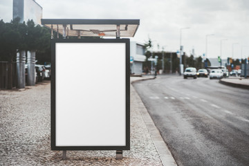 City bus stop on with an empty banner mockup; template of an advertising banner on the stop of...