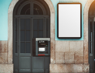White empty billboard mockup on the wall next to ATM indoors; a blank poster placeholder on a...