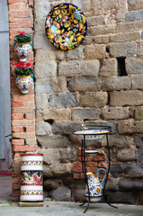 Deruta, a town in Umbria famous for its artistic hand-made and painted ceramics, Italy.. Vases, amphorae, plates, objects of furniture in ancient majolica.