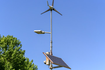 Alternative energy. Lampposts with windmills and solar pannels. Park. Moscow.	