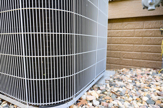 Residential Air Conditioning Unit Outdoors With Fan And Coils