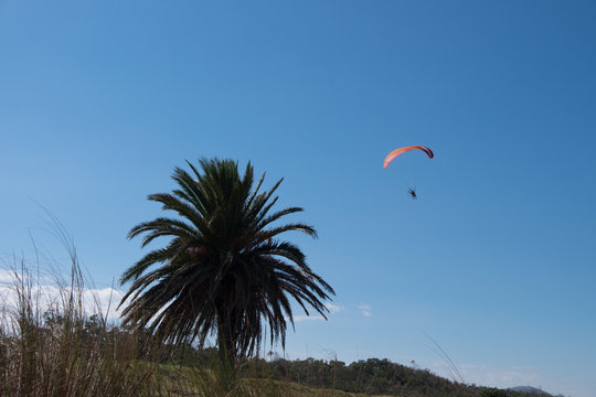 Parasailing over Las Flores Beach, on a very hot day during the summer at Maldonado, Uruguay.