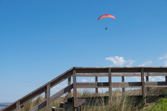 Parasailing over Las Flores Beach, on a very hot day during the summer at Maldonado, Uruguay.