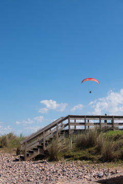 Parasailing over Las Flores Beach, on a very hot day during the summer at Maldonado, Uruguay.