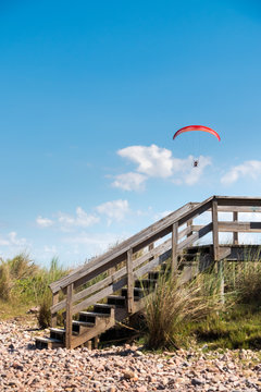 Parasailing over Las Flores Beach, on a very hot day during the summer at Maldonado, Uruguay.