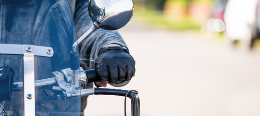 A closeup of a man sitting on his motorcycle. Concept motorcyclist.