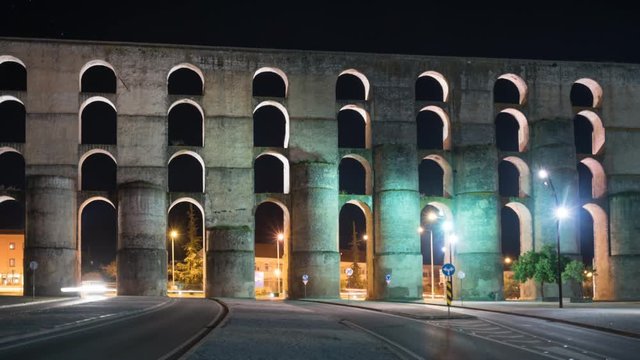 Timelapse of Elvas Aqueduct at night with cars passing with car light trails