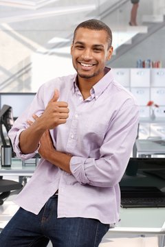Happy business office consultant giving thumbs up