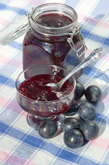 Plum jam and ripe plums on the table