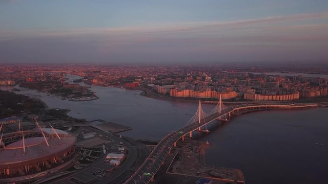 aerial sunset view cable Bridge ZSD road car rooftops zenit arena water Saint Petersburg Russia