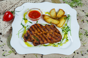 grilled meat on white plate.