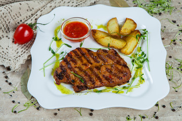 grilled meat on white plate.