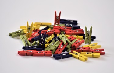Pile of miniature wooden clips.