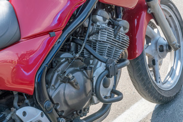 Red motorcycle engine close up.