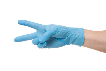 Right hand wearing latex surgical glove with gesture number two on wite background.