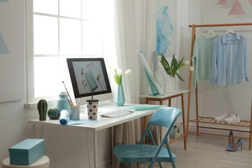 Fototapeta premium Stylish workplace interior with modern computer on desk