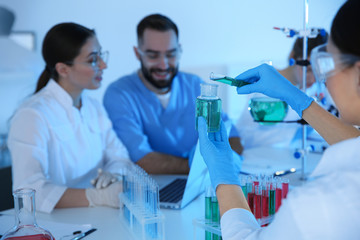 Fototapeta premium Medical students working in modern scientific laboratory