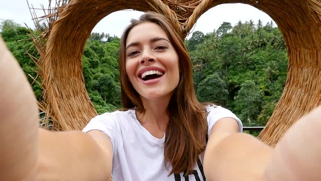  Beautiful girl having fun at the waterfalls in Bali