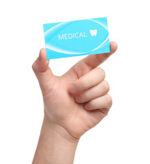 Man holding business card isolated on white, closeup. Dental medical service