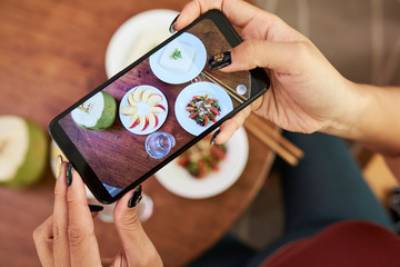 Woman posting food online