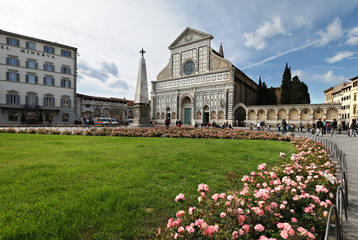 Fototapeta na wymiar The famous Church of Santa Maria Novella with tourists in Florence on a spring day in May. Italy