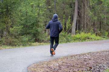 Fototapeta premium A man runs in the Park.