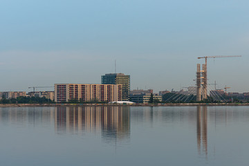 Fototapeta premium High Buildings Beautifully Reflected into Water in the Evening