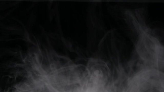 Plume of smoke, steam or vapor on black background for compositing. Enters frame from above and slowly falls / dissipates
