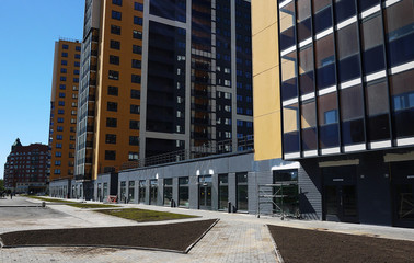 Stages of construction of a multi-storey building. The pouring of concrete and erection of panels floors. Details and close-up.