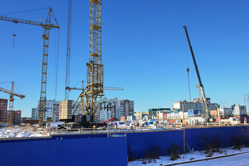 Obraz premium Stages of construction of a multi-storey building. The pouring of concrete and erection of panels floors. Details and close-up.