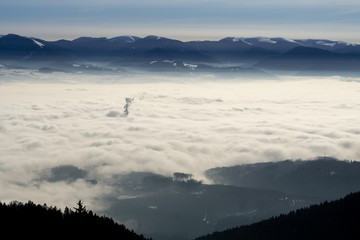 Clouds inversion in the town during autumn morning from mountains. Slovakia