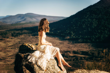 Kachi-Kalon, Bakhchysarai, Republic of Crimea, Russia - April 1, 2019: A girl in a white dress...