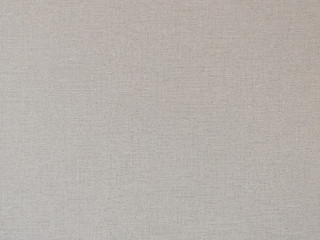 Fototapeta na wymiar closeup of beige linen texture background wallpaper.
