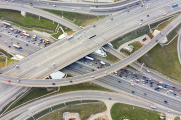 Aerial view of road junction in Moscow from above, automobile traffic and jam of many cars, road junction on the Moscow Ring Road and the M11 toll road.