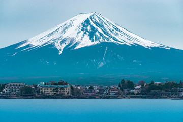 Fototapeta na wymiar Mount Fuji in winter with Kawaguchiko town on foreground