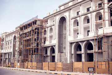 Obraz premium House with wooden scaffolding construction. Architecture and building concept
