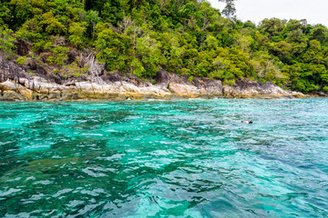 Beautiful tropical nature landscap, clear and clean turquoise sea and the tourist are snorkeling is a shallow dive site at Ko Ka Ta near Koh Lipe island Tarutao National Park, Satun, Thailandat