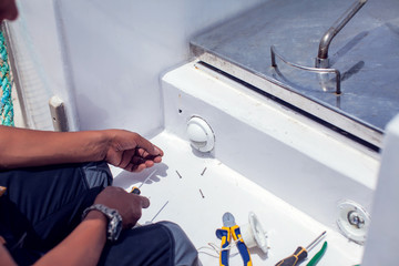 A man worker fix socket in the wall