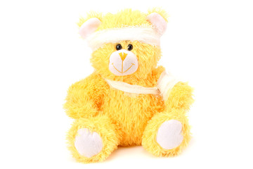toy teddy bear with bandage isolated on white background
