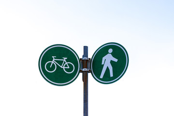Bike and walking lane sign at Stanley Park and seawall in Vancouver, Canada.