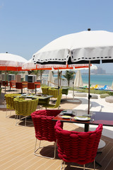 white beach umbrellas on the shore