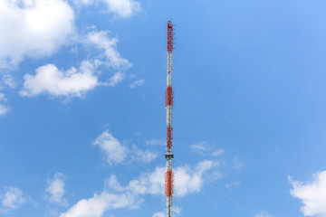 radio tower antenna in front of blue sky