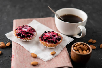flat lay cup with hot coffee, sweet cake on a black table, home cooked breakfasts