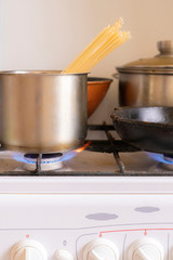 working obrn eith burning gas and pan with boiling tasty food in it,home cookings