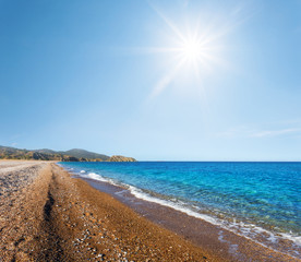 beautiful emerald sea beach at the hot summer sunny day